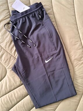 Nike Running Men's Black Joggers with a Reflective Swoosh and accents